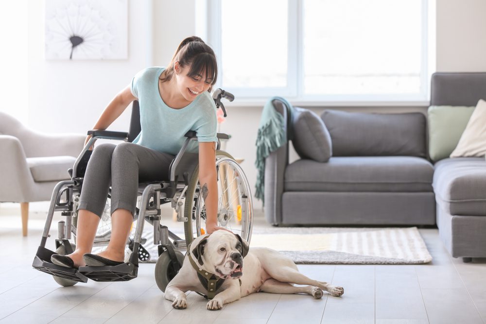young woman in wheelchair with service dog
