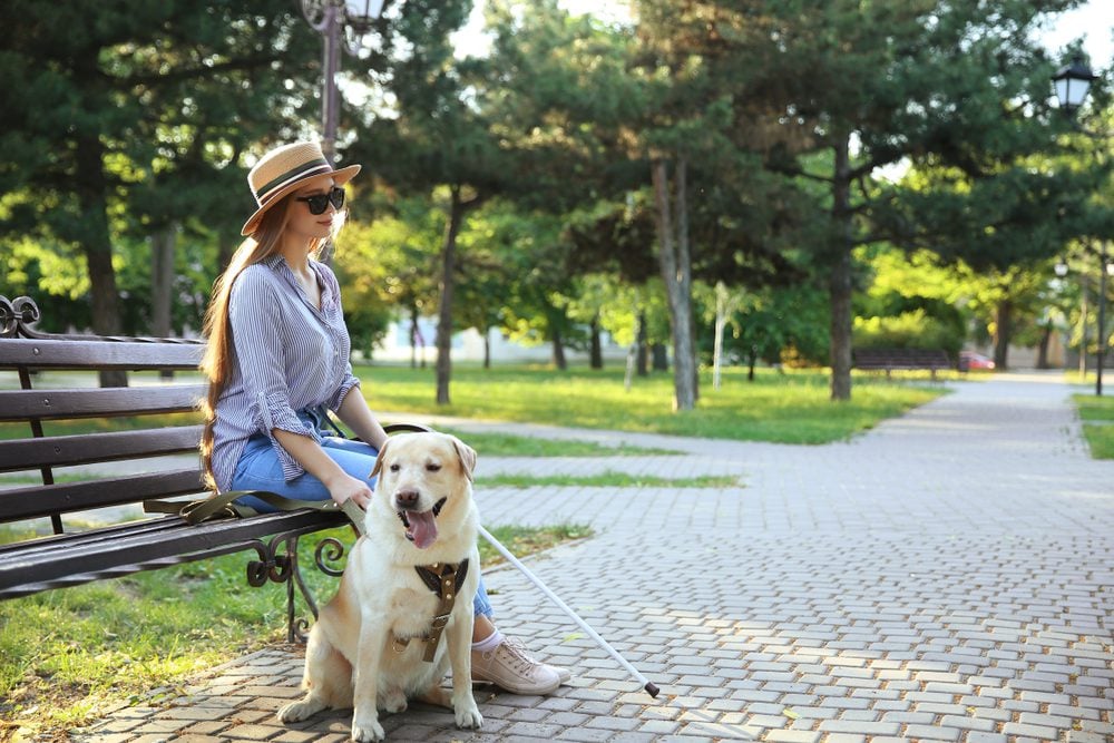 blind woman with guide dog